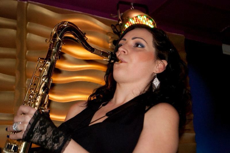 female saxophone player thane